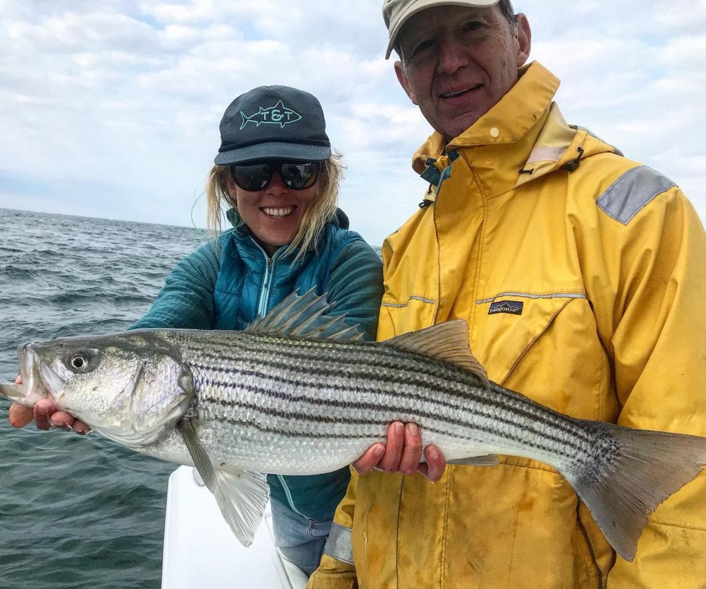 Kismet Outfitters Owner Abbie Schuster Fishing Striped Bass With A Client On Martha's Vineyard